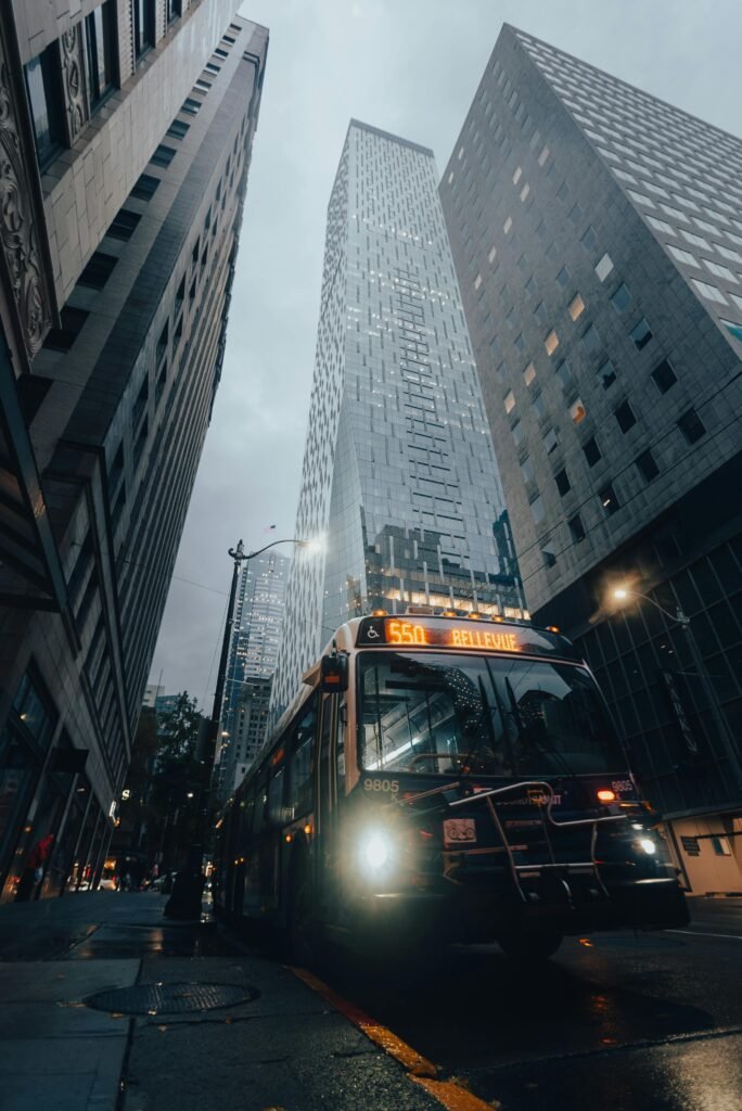 Moody shot of a city bus and skyscrapers in downtown Seattle on a gloomy day.